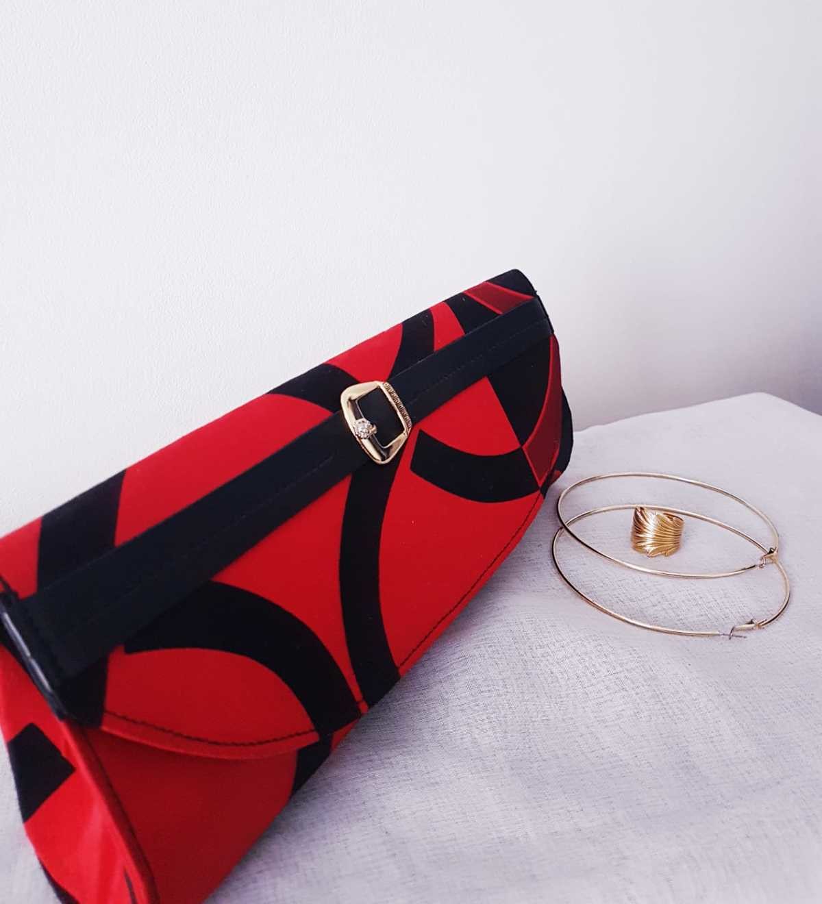 clutch purse with hand grip
