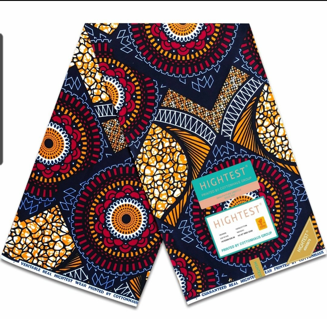 Geometric Ankara Wax Print Fabric with Green, Orange, and Brown Patterns